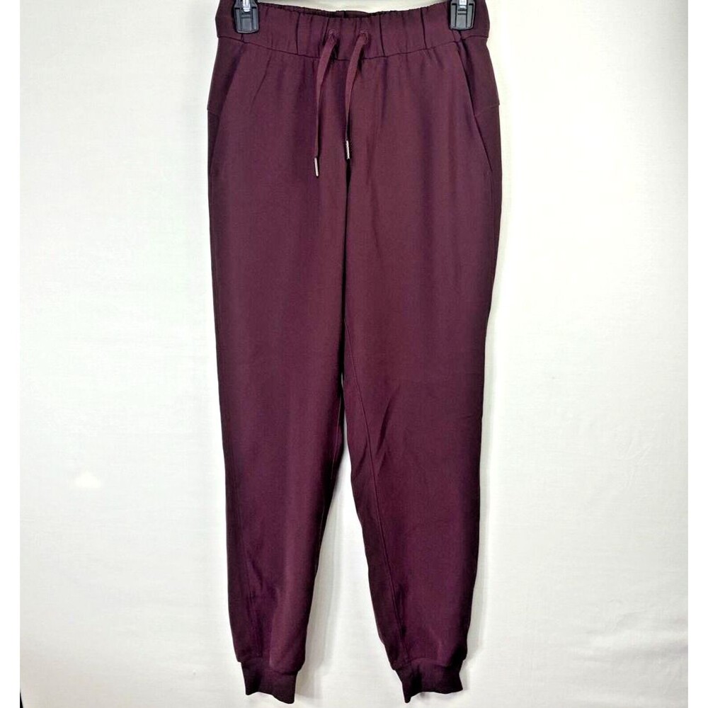 Lululemon On The Fly Jogger Womens Size 2 Wine Red Ankle Cuffed Woven Pant